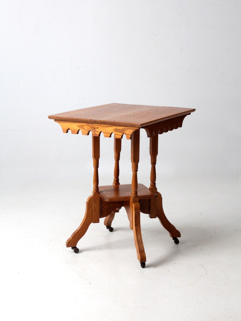 Late 19th Century Victorian Rectangular Side Table with Turned Legs and Casters: Late 19th Century Victorian Rectangular Side Table with Turned Legs and Casters This late 19th century Victorian side table features a rectangular top with a scalloped apron, turned legs, and a lower 