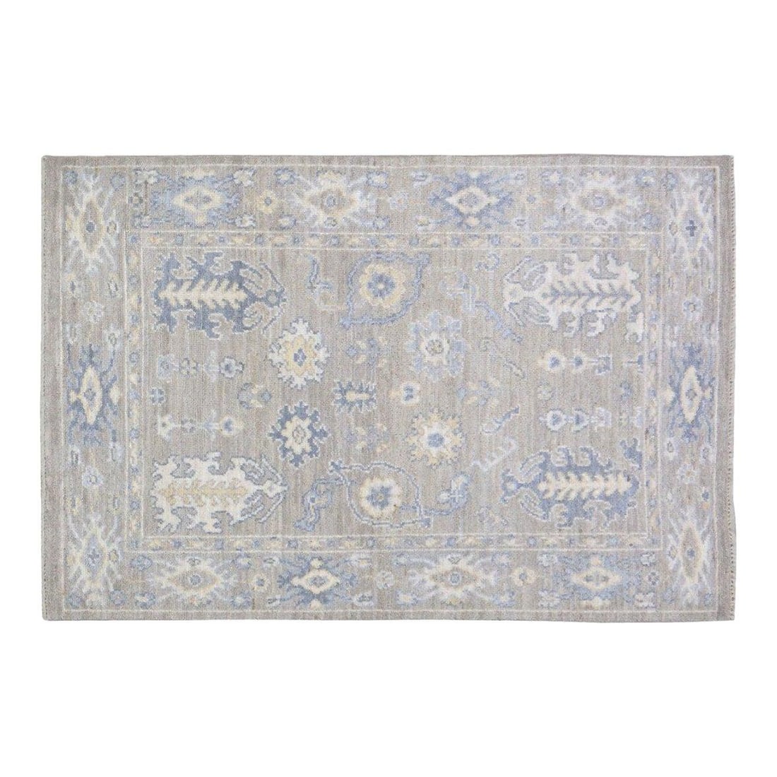 Hand-Knotted Wool Oushak Rug in Dove Gray 4'x6'2": Hand-Knotted Wool Oushak Rug in Dove Gray 4'x6'2" This hand-knotted Turkish Oushak rug showcases soft, muted tones and large-scale motifs characteristic of the style. Crafted from luxurious wool, it f