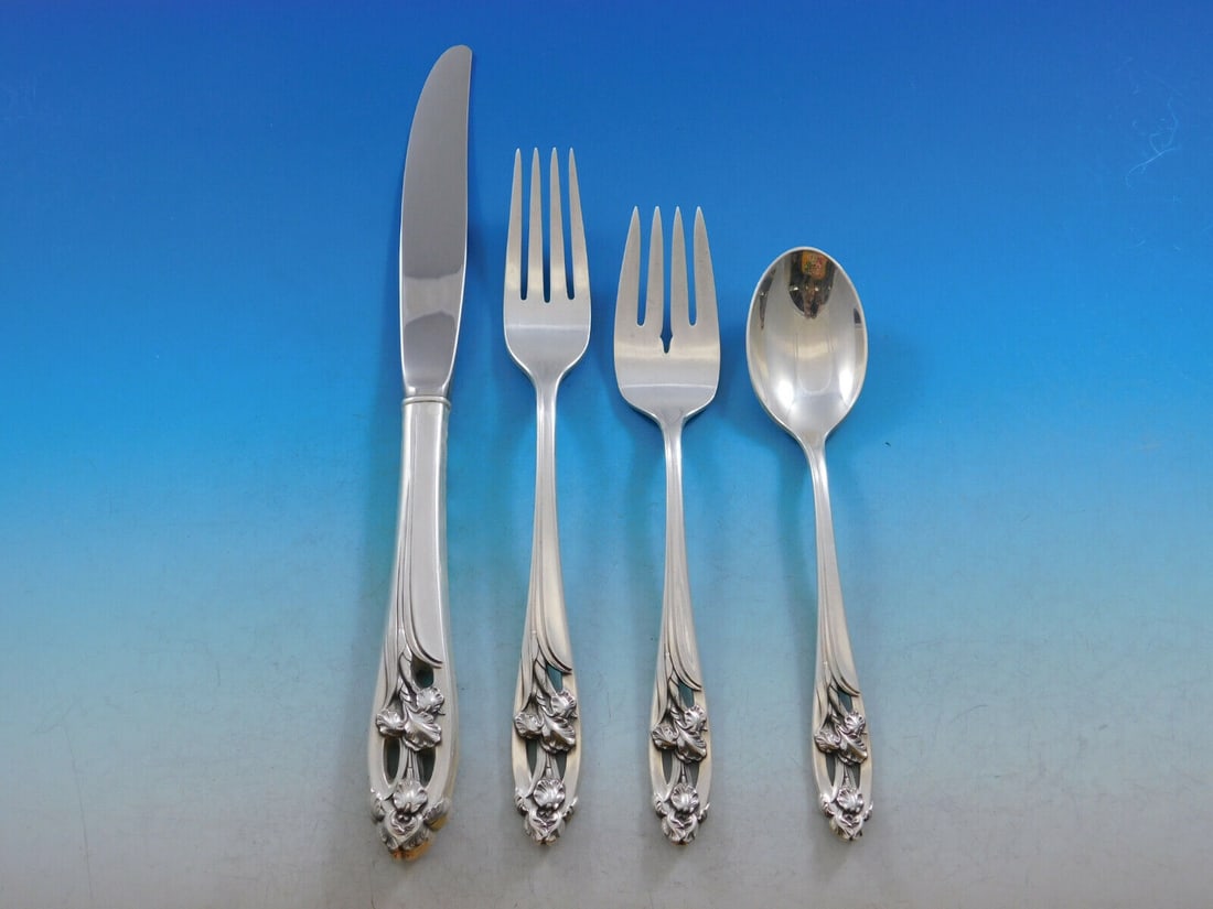International Silver Silver Iris 4-Piece Sterling Silver Place Setting: International Silver Silver Iris 4-Piece Sterling Silver Place Setting Enhance your dining experience with this exquisite 4-piece regular size place setting from International Silver, featuring the el