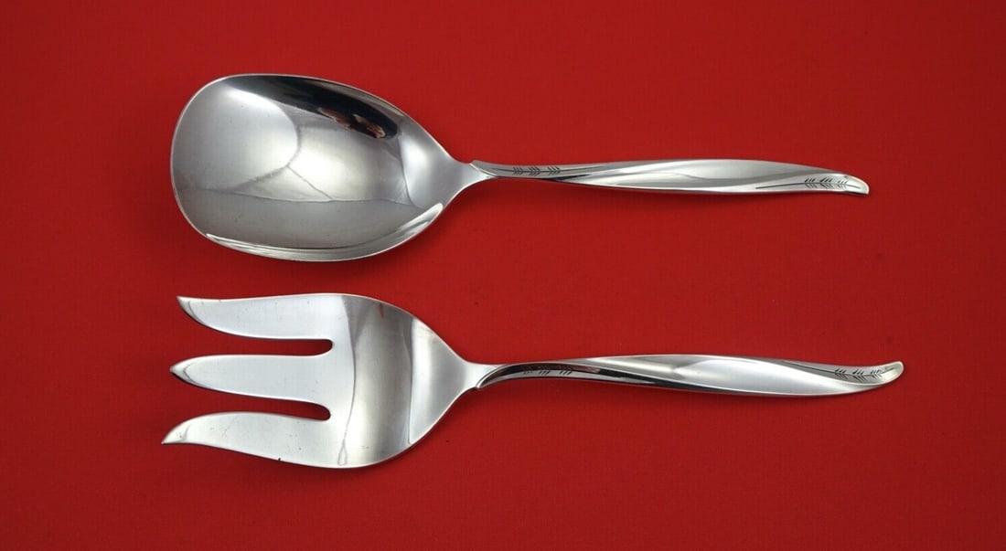 International Sterling Silver Pine Spray Salad Serving Set 9 inch Flat Handle: International Sterling Silver Pine Spray Salad Serving Set 9 inch Flat Handle Enhance your dining experience with this exquisite Pine Spray Salad Serving Set by International Sterling Silver. Featurin