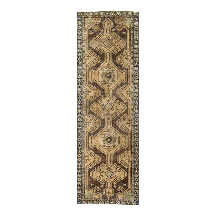 Vintage Tribal Hand-Knotted Wool Runner 3'1 x 9'7 Tan: Vintage Tribal Hand-Knotted Wool Runner 3'1 x 9'7 Tan Enhance your space with this stunning Vintage Tribal hand-knotted wool runner. Featuring a warm tan field and intricate brown accents, this rug sh