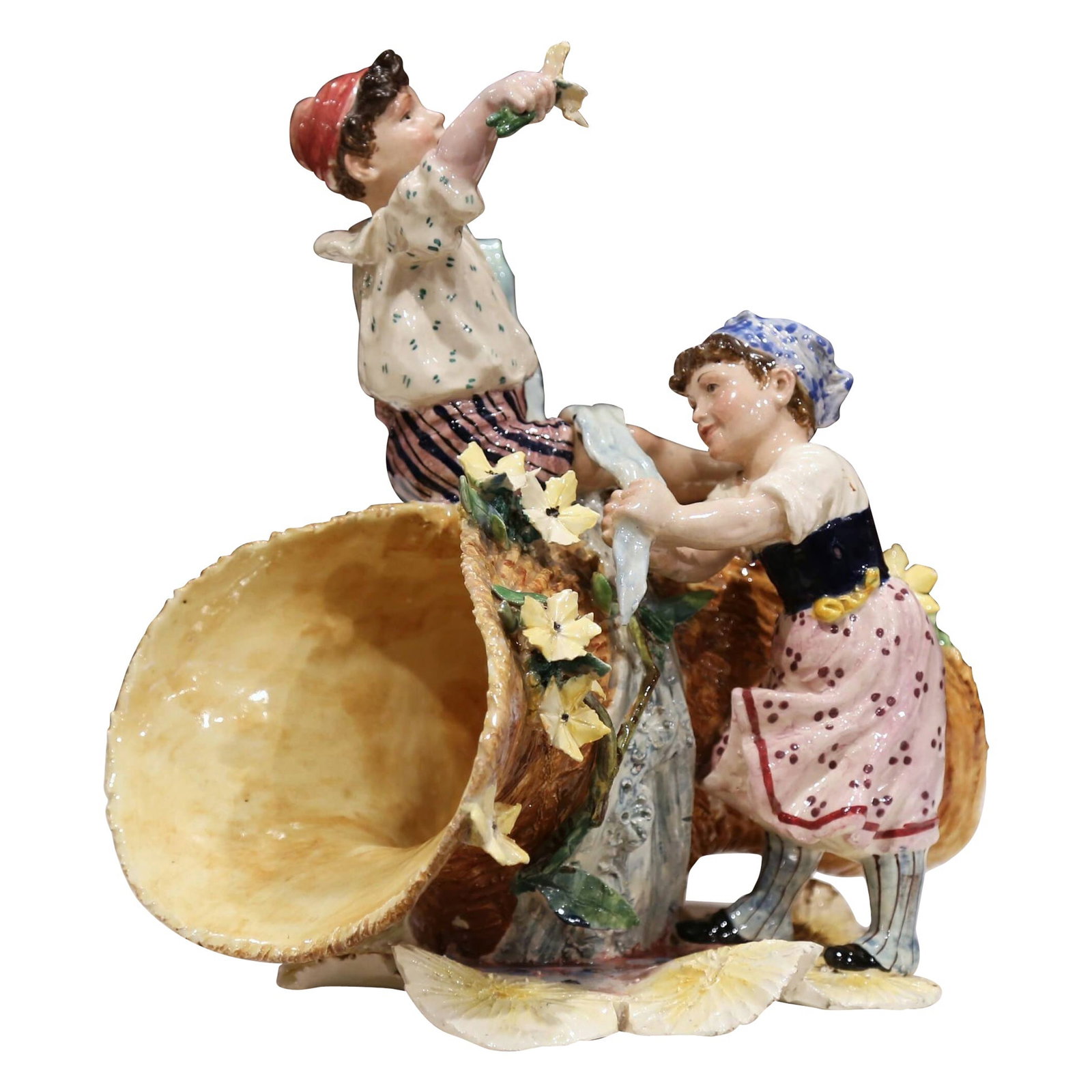 Charming Early 20th Century French Majolica Children Sculpture: Charming Early 20th Century French Majolica Children Sculpture This exquisite Early 20th Century French Majolica Cornucopia Sculpture is a delightful centerpiece that adds a touch of charm to any deco