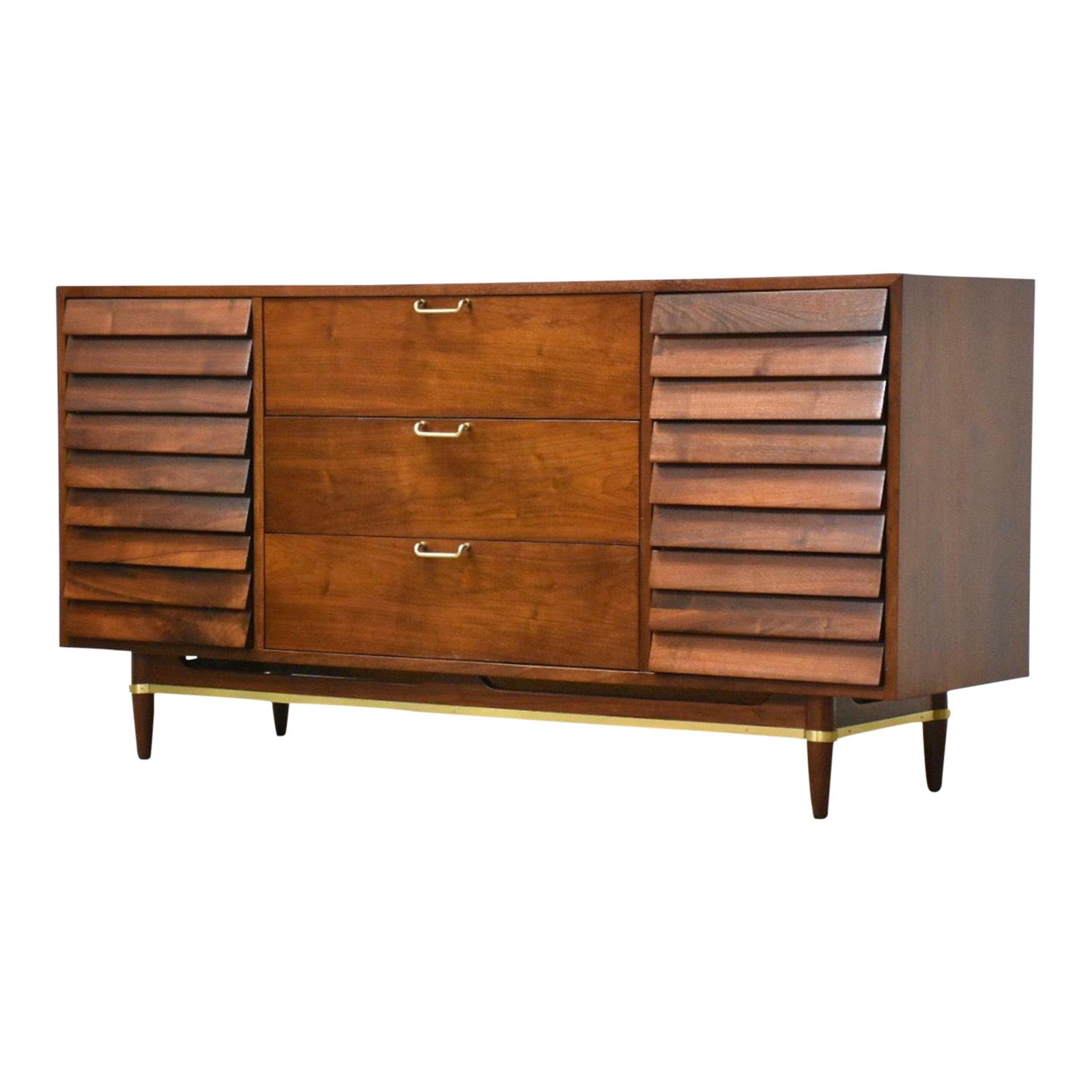 Mid Century Walnut Long Dresser by Merton Gershun for American of Martinsville: Mid Century Walnut Long Dresser by Merton Gershun for American of Martinsville This mid-century modern long dresser is crafted from walnut and features polished brass hardware along with louvered draw