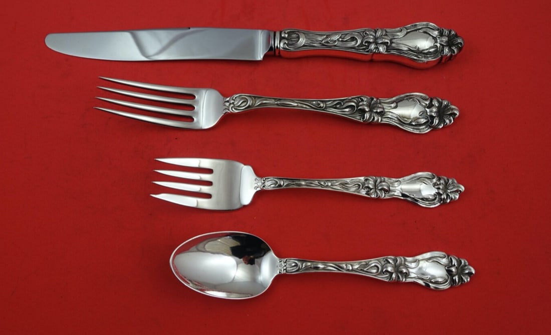Frank Whiting Lily Sterling Silver 4-Piece Dinner Set: Frank Whiting Lily Sterling Silver 4-Piece Dinner Set This exquisite 4-piece dinner place setting features the "Lily" pattern by Frank M. Whiting, crafted from high-quality sterling silver. The set in