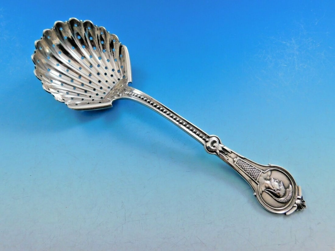 Wood & Hughes Medallion Sterling Silver Sugar Sifter 7 3/4": Wood & Hughes Medallion Sterling Silver Sugar Sifter 7 3/4" This exquisite sterling silver sugar sifter, measuring 7 3/4", is crafted by Wood & Hughes and showcases the elegant Medallion pattern, also