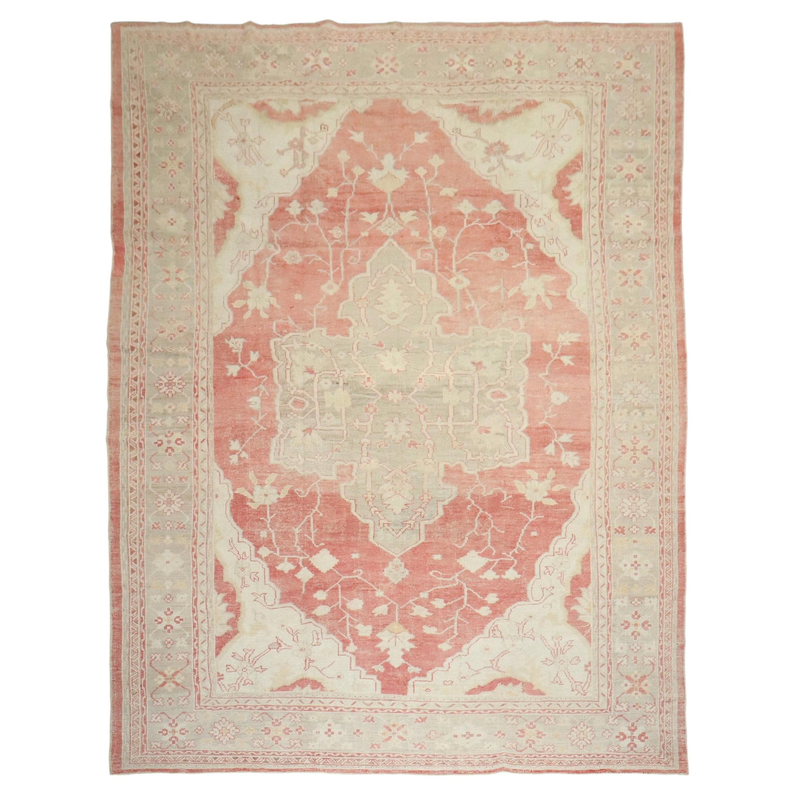 Early 20th Century Turkish Oushak Wool Rug 11'4 x 16'6: Early 20th Century Turkish Oushak Wool Rug 11'4 x 16'6 This early 20th-century Turkish Oushak rug features a soft palette of reds and creams, characteristic of the region's renowned weaving tradition.