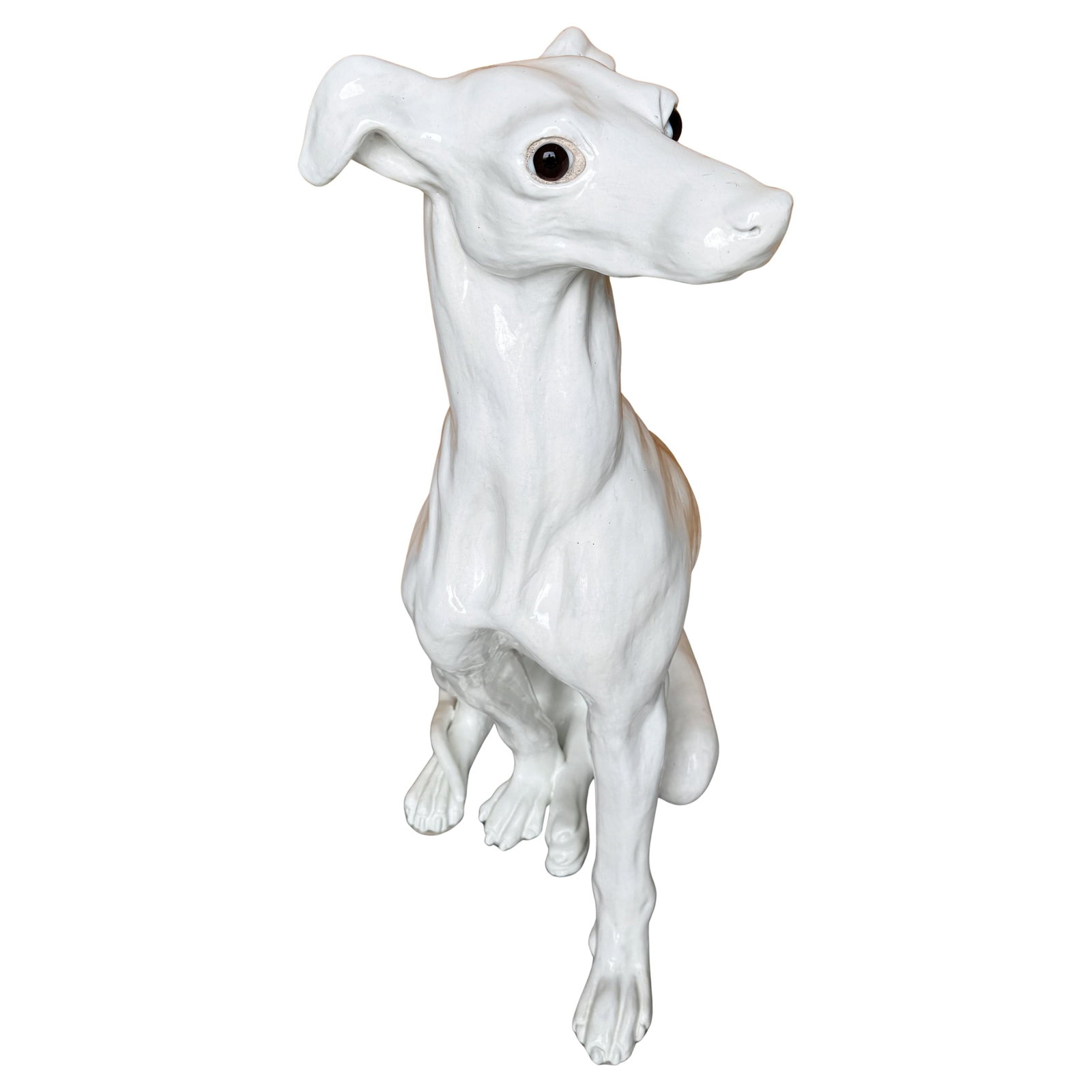 Life-Size Italian Hollywood Regency Seated Whippet Sculpture White Glazed Terracotta 1960s: Life-Size Italian Hollywood Regency Seated Whippet Sculpture White Glazed Terracotta 1960s This stunning life-size Italian Hollywood Regency sculpture features a seated Whippet, crafted from white-gla