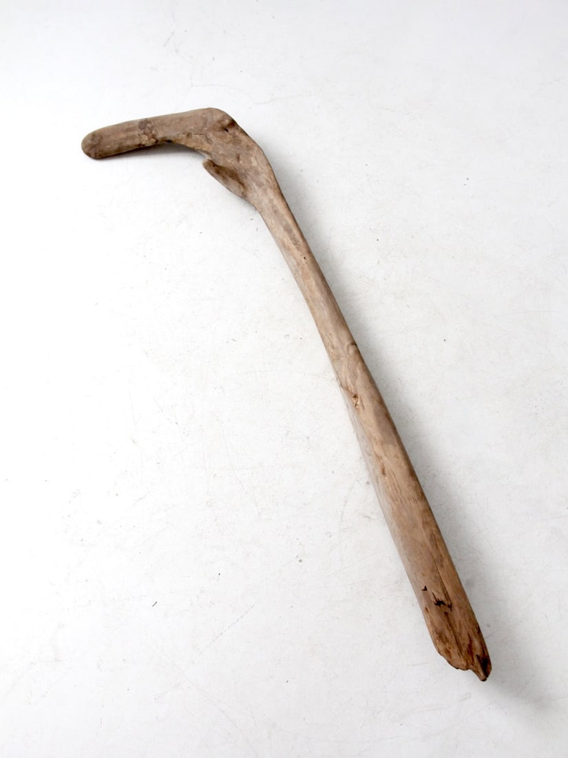 Vintage Driftwood Cane Accent 58 Inch Coastal Decor: Vintage Driftwood Cane Accent 58 Inch Coastal Decor This unique vintage driftwood piece, resembling a cane or hockey stick, showcases a beautifully weathered surface with rich patina and organic wear 