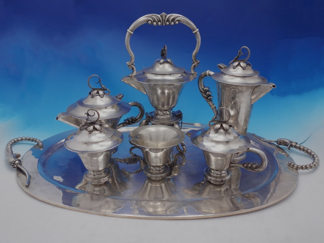 Blossom Mexican Sterling Silver 7-Piece Tea Set: Blossom Mexican Sterling Silver 7-Piece Tea Set Experience elegance with this stunning Blossom Mexican sterling silver tea set, featuring a 7-piece collection perfect for any tea or coffee occasion. T