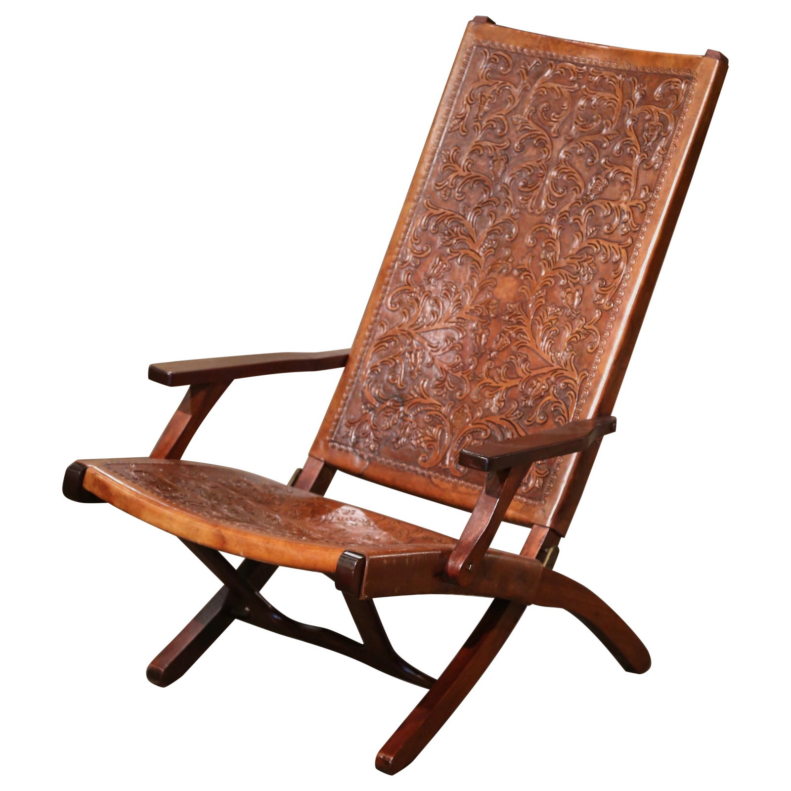 Spanish Walnut and Tooled Leather Folding Lounge Chair Circa 1960: Spanish Walnut and Tooled Leather Folding Lounge Chair Circa 1960 This mid-century Spanish folding lounge chair, crafted circa 1960, features a solid walnut frame with hand-carved details and a patina