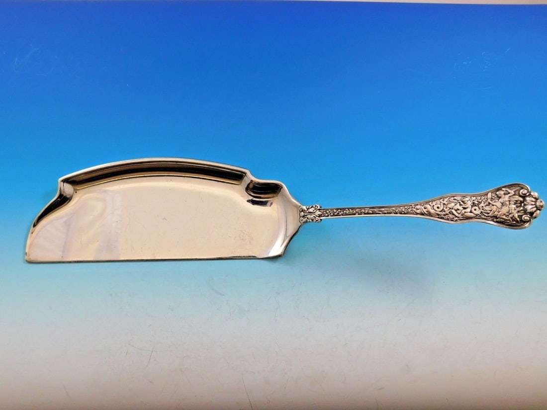 Tiffany & Co Olympian Sterling Silver Crumber 12 1/2 inches with Venus Motif: Tiffany & Co Olympian Sterling Silver Crumber 12 1/2 inches with Venus Motif Discover the exquisite Olympian Crumber by Tiffany & Co., crafted from high-quality sterling silver. Measuring 12 1/2