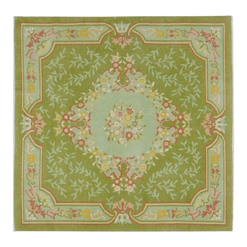 Hand-Knotted Wool Chinese Art Deco Rug Olive 4'10" x 4'9": Hand-Knotted Wool Chinese Art Deco Rug Olive 4'10" x 4'9" This vintage Chinese Art Deco rug is hand-knotted from wool using traditional rug-making techniques. It features a rich olive color and offers