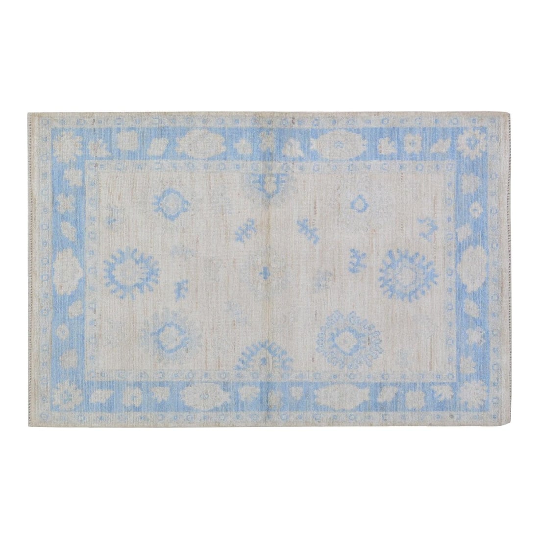4'2" x 6'4" Wool Area Rug in Oushak Design Hand Knotted: 4'2" x 6'4" Wool Area Rug in Oushak Design Hand Knotted This Oushak hand-knotted wool rug is crafted using traditional techniques, combining timeless artistry with a modern design approach. Its durabl