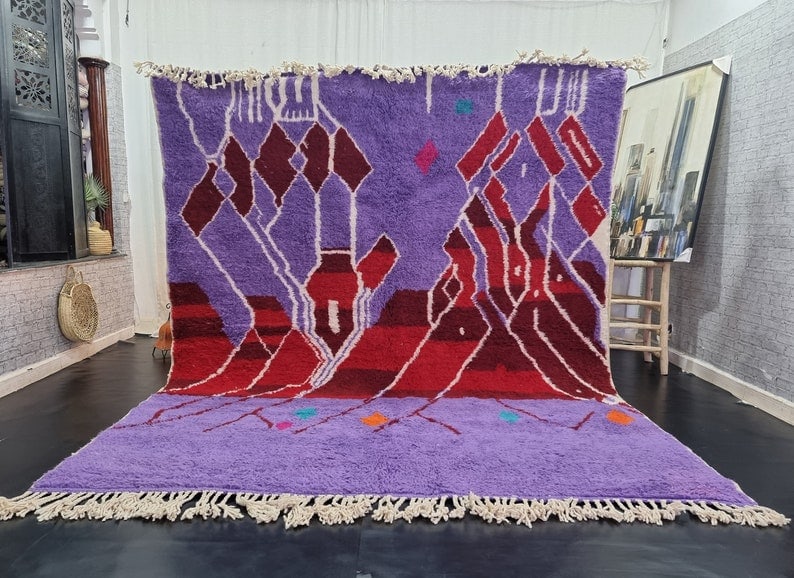 Authentic Moroccan Handwoven Purple Wool Rug 9.84 x 6.56 Feet: Authentic Moroccan Handwoven Purple Wool Rug 9.84 x 6.56 Feet Discover the charm of this Elegant Artistic Handwoven Moroccan Berber Wool Rug. Crafted by local Berber women weavers in the Atlas Mountai