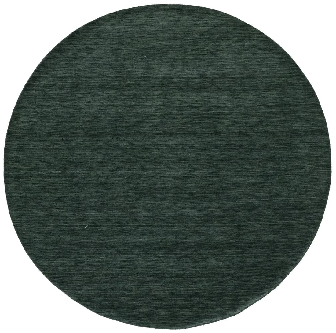 Round Hand-Loomed Wool Gabbeh Rug in Dark Green 7'9 x 7'10: Round Hand-Loomed Wool Gabbeh Rug in Dark Green 7'9 x 7'10 This dark green round rug features a solid design and is hand-loomed from wool. It offers a medium pile height, making it comfortable underfo