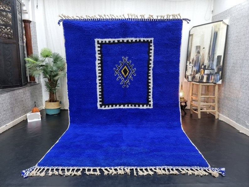 Handmade Moroccan Berber Carpet Blue Art Design 9.84 x 6.56 Feet: Handmade Moroccan Berber Carpet Blue Art Design 9.84 x 6.56 Feet Transform your space with this stunning luxury soft handmade Moroccan Berber carpet. Featuring a captivating blue color with a traditio