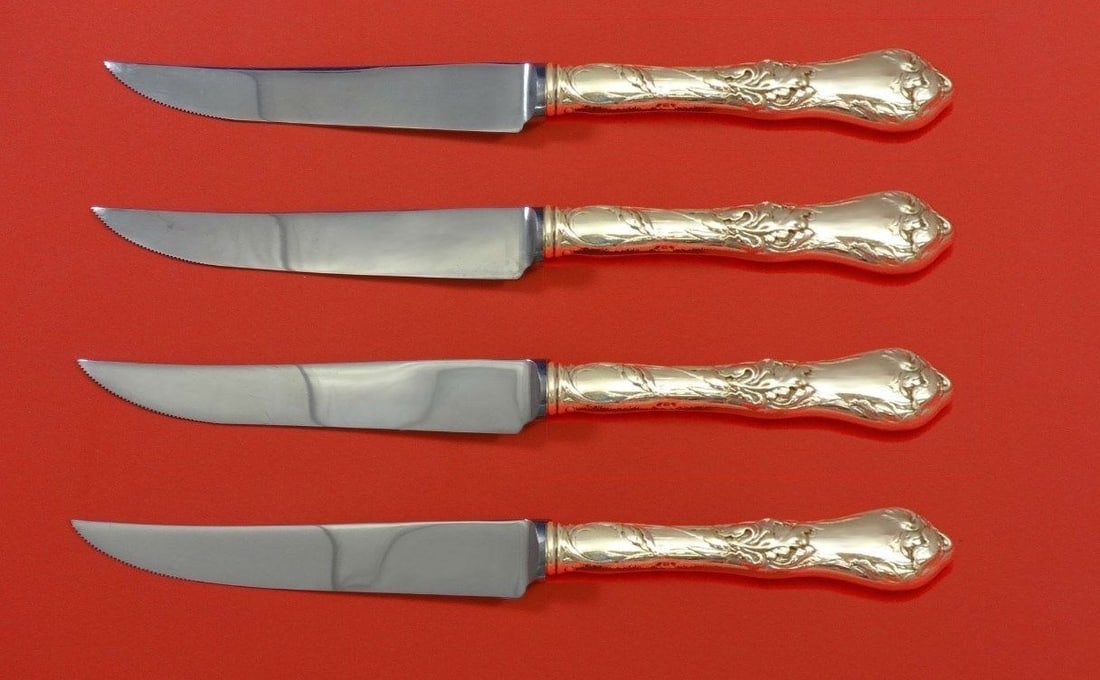 Reed & Barton Les Cinq Fleurs Sterling Silver Steak Knife Set 4pc: Reed & Barton Les Cinq Fleurs Sterling Silver Steak Knife Set 4pc This exquisite 4-piece steak knife set features the elegant Les Cinq Fleurs pattern by Reed & Barton. Each knife is crafted from sterl