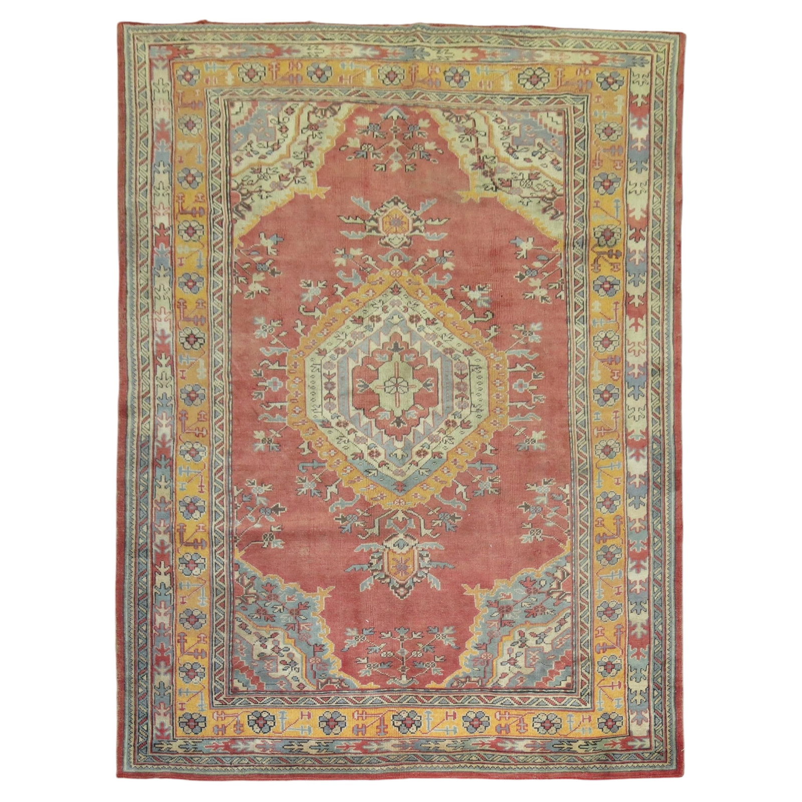 1940s Turkish Oushak Wool Rug 6'6 x 9'2: 1940s Turkish Oushak Wool Rug 6'6 x 9'2 This vintage Turkish Oushak rug from the 1940s features hand-woven wool construction with mustard yellow and green accents on a red background. The rug exemplif