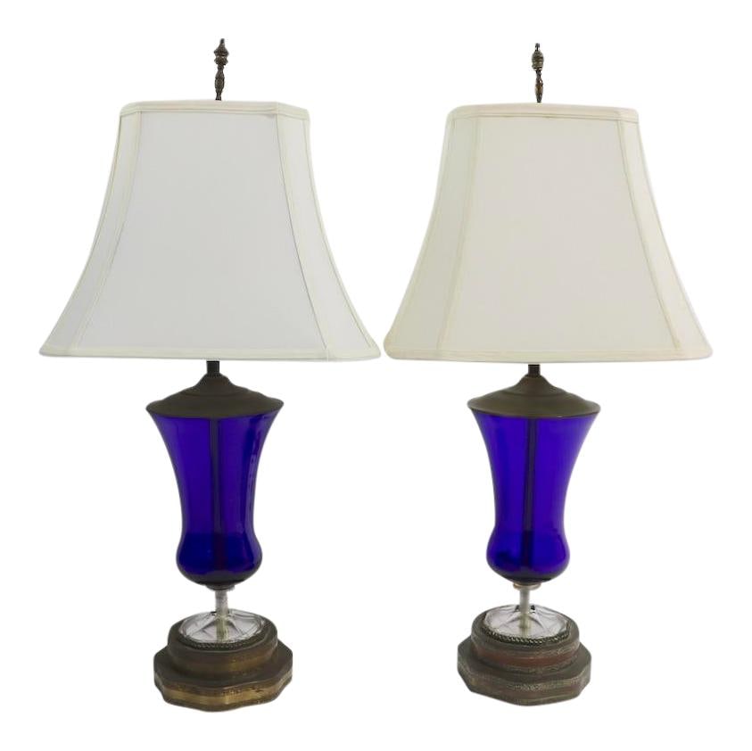 Art Deco Cobalt Glass Urn Lamps Pair 30 inches Blue: Art Deco Cobalt Glass Urn Lamps Pair 30 inches Blue This elegant pair of cobalt glass urn form lamps features a striking Art Deco design, showcasing both Deco and Formal stylistic influences. Each