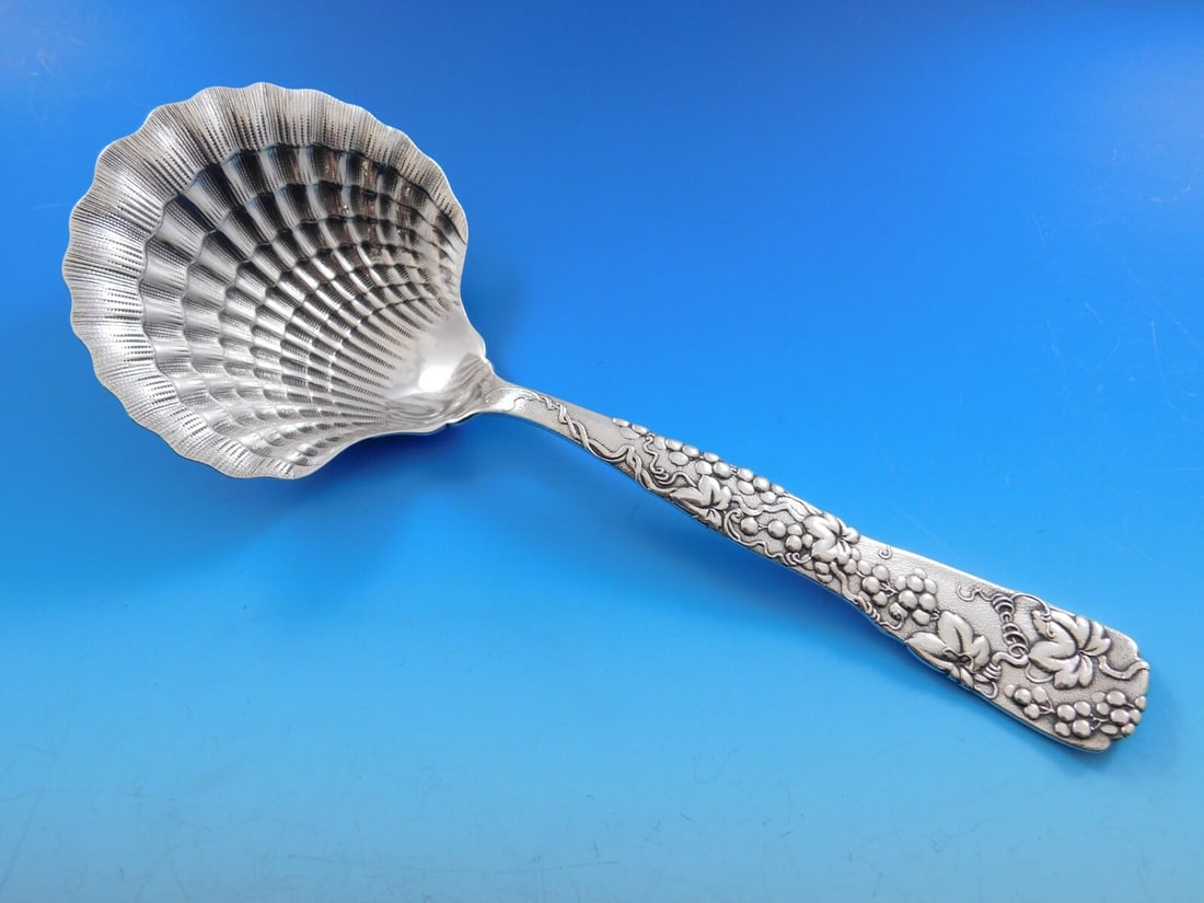 Tiffany & Co Vine Sterling Silver 9 Inch Berry Spoon Clam Shell Grapes: Tiffany & Co Vine Sterling Silver 9 Inch Berry Spoon Clam Shell Grapes This exquisite Vine pattern serving spoon by Tiffany & Co. features a stunning clam shell design adorned with a grapes motif. Cra