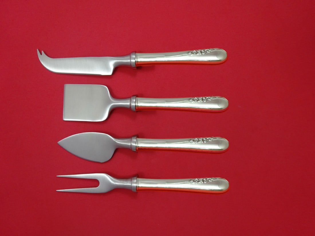 International Blossom Time Sterling Silver 4pc Cheese Serving Set: International Blossom Time Sterling Silver 4pc Cheese Serving Set Enhance your entertaining experience with the Blossom Time Cheese Serving Set by International Sterling. This exquisite 4-piece hostes
