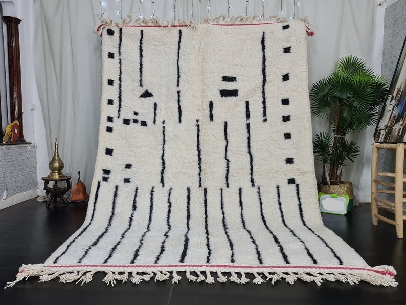 Handmade White Moroccan Berber Wool Rug 9.84 x 6.56 Feet: Handmade White Moroccan Berber Wool Rug 9.84 x 6.56 Feet This beautiful soft white handmade Moroccan Berber wool rug is a stunning addition to any space. Handwoven by local Berber women weavers in the