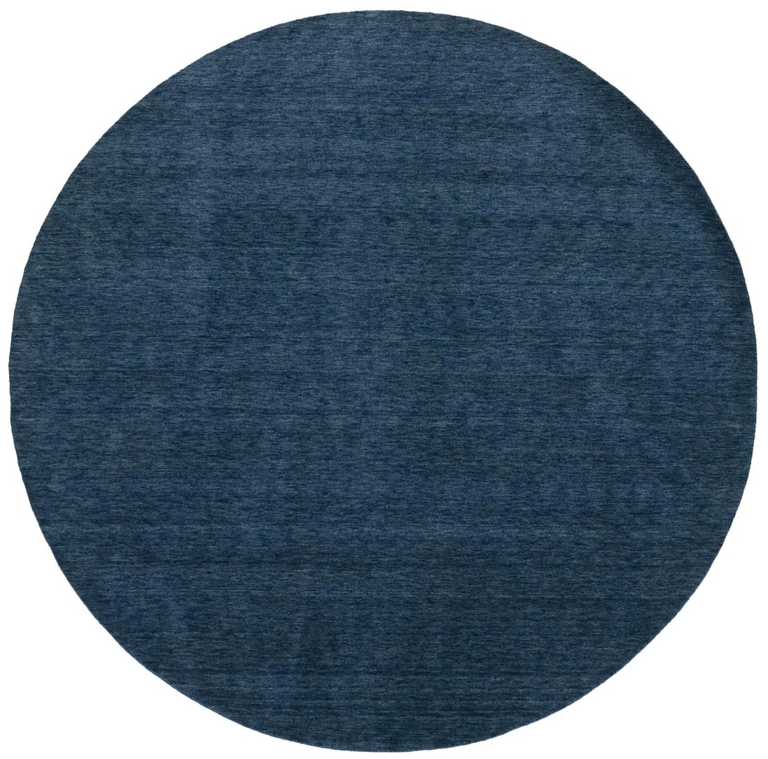 Modern Hand-Loomed Wool Round Rug in Steel Blue 6 Foot Diameter: Modern Hand-Loomed Wool Round Rug in Steel Blue 6 Foot Diameter This hand-loomed round Gabbeh wool rug features a solid steel blue design that complements modern interiors. Crafted in India, the rug m
