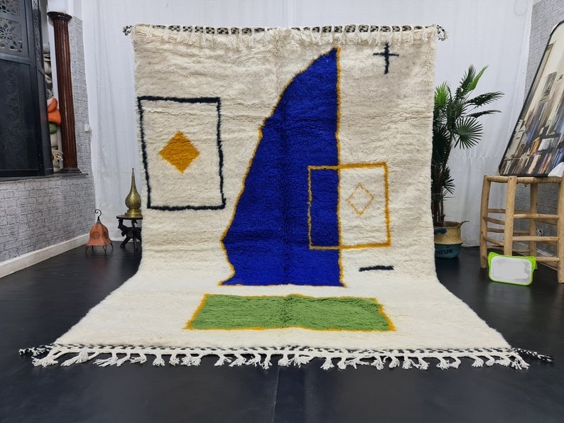 Handmade Colorful Moroccan Berber Wool Rug 9.84 x 6.56 Feet: Handmade Colorful Moroccan Berber Wool Rug 9.84 x 6.56 Feet Discover the beauty of this authentic handmade Moroccan Berber area rug, featuring a stunning abstract design in vibrant shades of green, bl