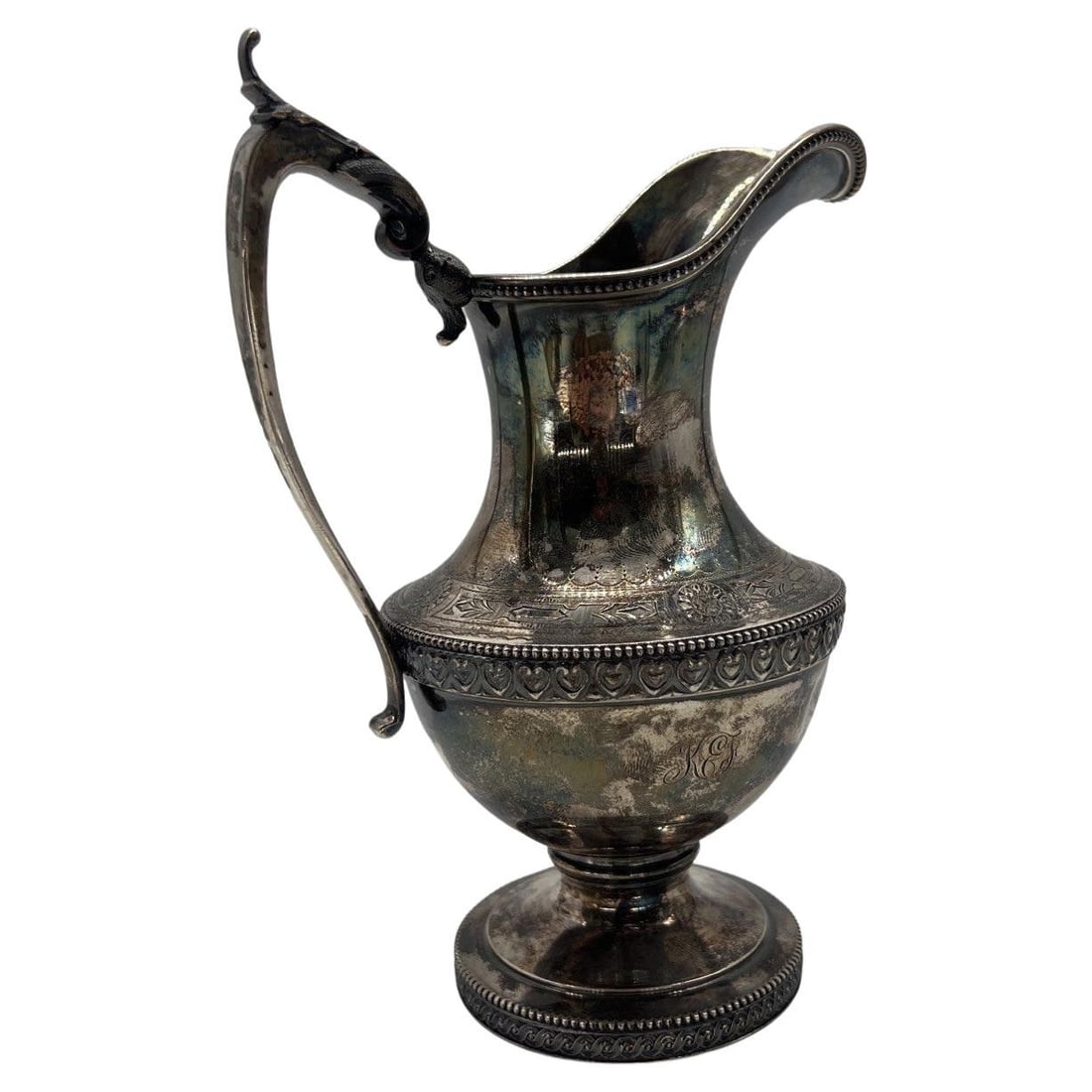 Antique Boston Sterling Silver Creamer Pitcher C. 1860 with Double Monograms: Antique Boston Sterling Silver Creamer Pitcher C. 1860 with Double Monograms This exquisite antique creamer pitcher, crafted from sterling silver, showcases a beautiful hand-chased design that embodie