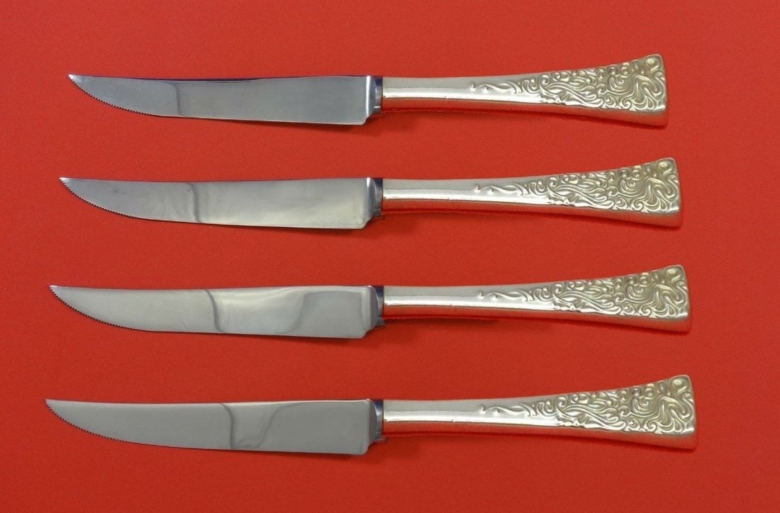 Reed & Barton Tapestry Sterling Silver Steak Knife Set 4pc: Reed & Barton Tapestry Sterling Silver Steak Knife Set 4pc Enhance your dining experience with this exquisite 4-piece steak knife set from Reed & Barton, featuring the elegant Tapestry pattern. Crafte