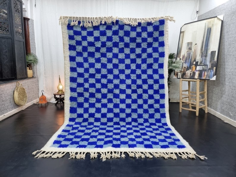 Authentic Handmade Moroccan Berber Wool Rug 10 x 5 Feet Soft Blue: Authentic Handmade Moroccan Berber Wool Rug 10 x 5 Feet Soft Blue Elevate your home decor with this exquisite Soft Blue Handmade Moroccan Berber Wool Rug. Handwoven by skilled Berber women in the Atla