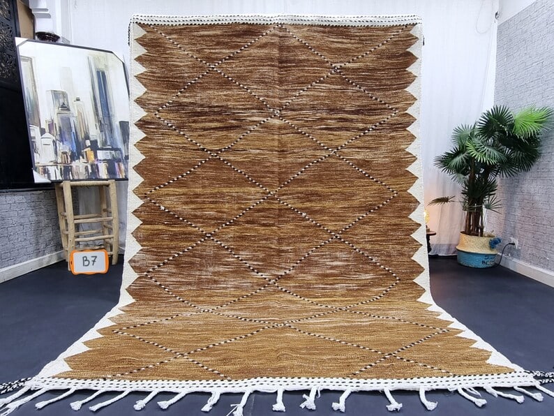 Authentic Handwoven Brown Rug 8 x 5 Feet from Morocco: Authentic Handwoven Brown Rug 8 x 5 Feet from Morocco Enhance your space with this lovely authentic brown rug, beautifully handwoven in the Atlas Mountains by local Berber women weavers. Crafted with 