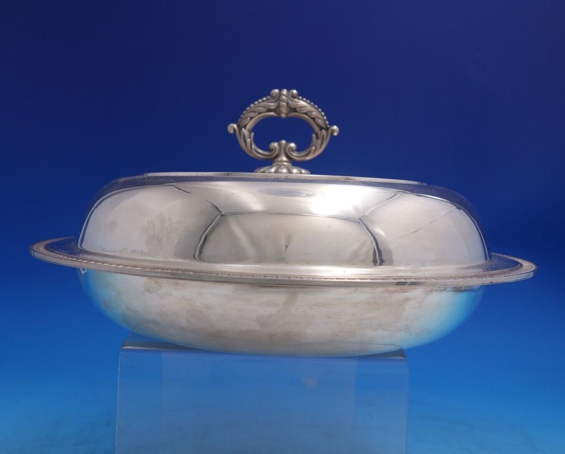 Empire Italian Sterling Silver Covered Vegetable Dish with Handle 1960s: Empire Italian Sterling Silver Covered Vegetable Dish with Handle 1960s Introducing a remarkable Empire pattern vegetable dish crafted from sterling silver, hailing from Italy and dating back to the 1