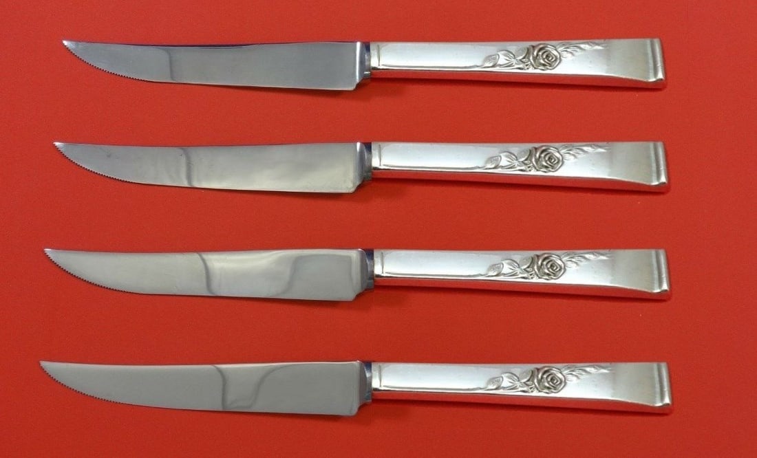 Reed and Barton Classic Rose Sterling Silver Steak Knife Set 4pc: Reed and Barton Classic Rose Sterling Silver Steak Knife Set 4pc This exquisite 4-piece steak knife set features the Classic Rose pattern by Reed and Barton. Each knife is crafted with a sterling silv