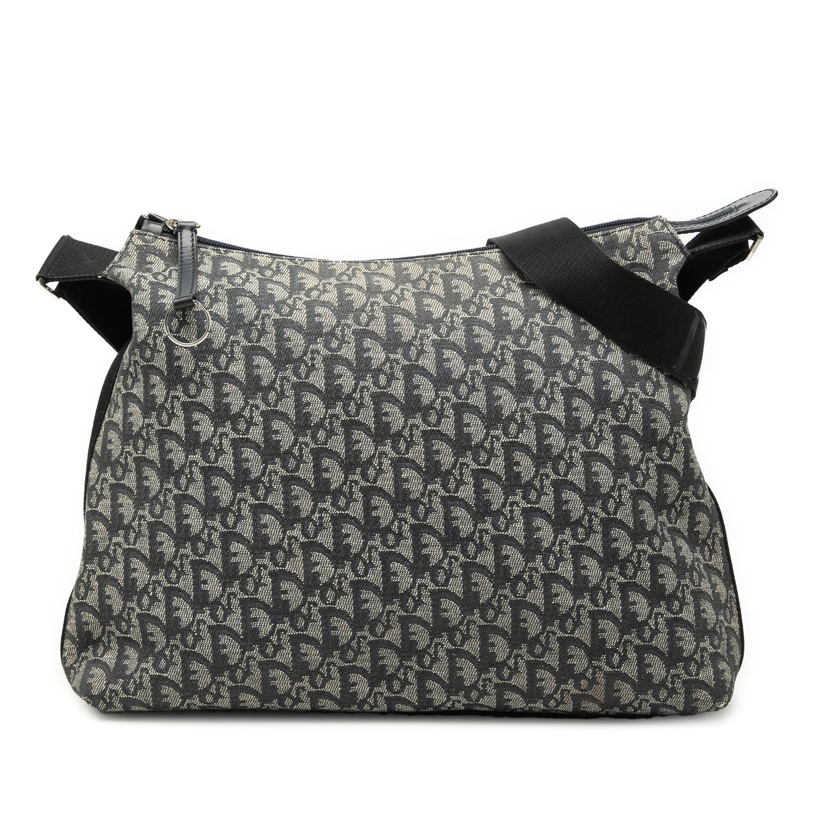 Dior blue canvas crossbody bag Diorissimo Trotter: Dior blue canvas crossbody bag Diorissimo Trotter This Diorissimo Trotter Canvas Crossbody bag features a blue canvas body with an adjustable flat shoulder strap. It is designed with a top zip closure