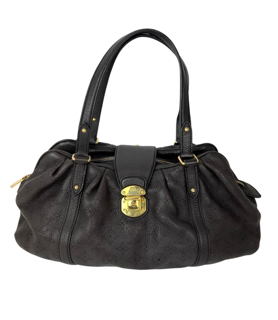 Mahina Lunar GM Large Brown Leather Shoulder Bag by Louis Vuitton: Mahina Lunar GM Large Brown Leather Shoulder Bag by Louis Vuitton The Louis Vuitton Lunar GM Mahina is a large dark brown leather shoulder bag featuring a distinctive trapezoid silhouette and perforat
