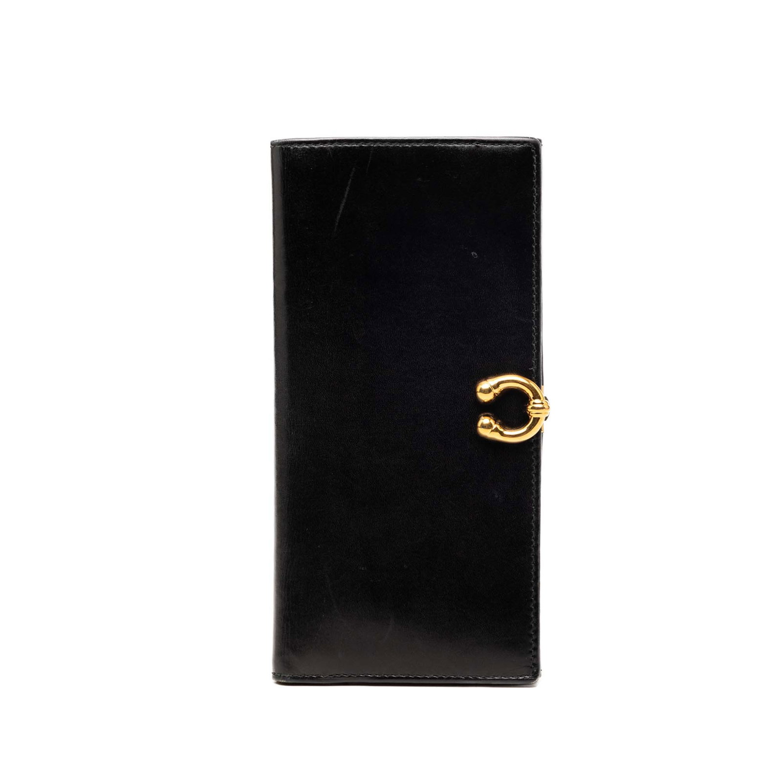 Gucci Horseshoe Flap Long Wallet in Black Calfskin: Gucci Horseshoe Flap Long Wallet in Black Calfskin Gucci Calfskin Horseshoe Long Wallet in black leather with a flap and clasp closure. The design includes an exterior back flap compartment and interi