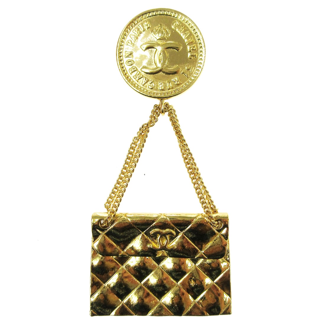 Chanel Gold Tone Bag Motif Brooch Pin: Chanel Gold Tone Bag Motif Brooch Pin Gold-tone Chanel brooch featuring a bag motif. This piece has a gold color finish and shows reasonable wear and tear consistent with the stated condition. Specifi