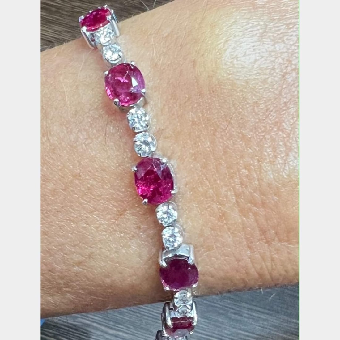 Elegant 18K White Gold Ruby Diamond Bracelet 22 Diamonds 11 Rubies: Elegant 18K White Gold Ruby Diamond Bracelet 22 Diamonds 11 Rubies This exquisite 18K White Gold Bracelet showcases a stunning combination of 22 diamonds and 11 rubies. The bracelet weighs 13.5 grams 