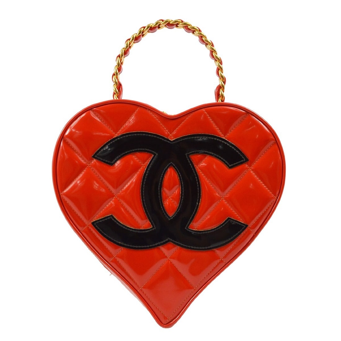 CHANEL Quilted Vanity Handbag Red Patent Leather Heart Shape: CHANEL Quilted Vanity Handbag Red Patent Leather Heart Shape Heart-shaped Chanel vanity handbag in red patent leather with quilted detailing, a top handle, zip closure, and inner pocket. The bag is ma