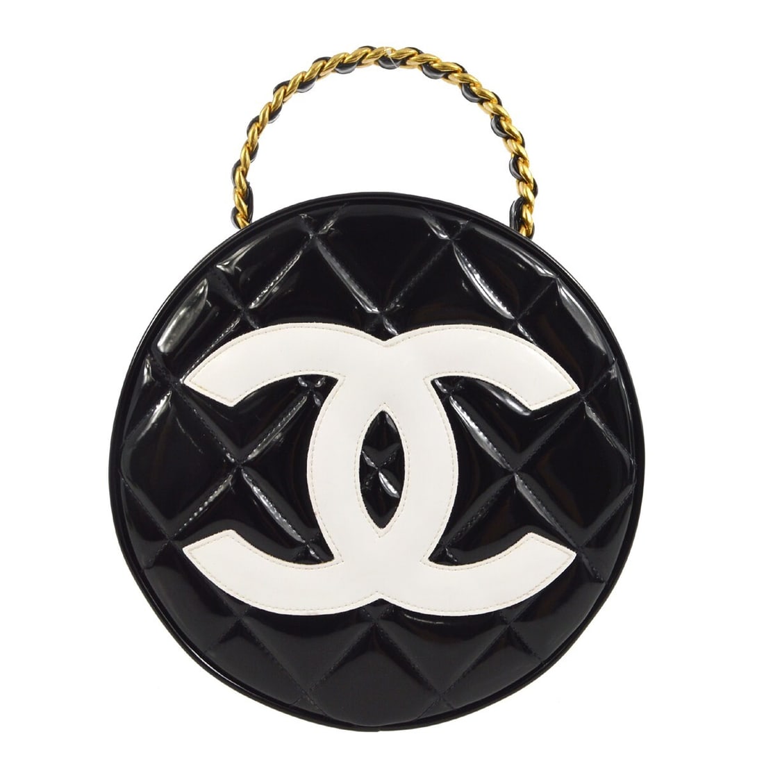 CHANEL Quilted Round Vanity Bag in Black Patent Leather: CHANEL Quilted Round Vanity Bag in Black Patent Leather Chanel round vanity handbag in black patent leather with a zip closure and top handle. The bag features the Chanel Quilted line styling and is m