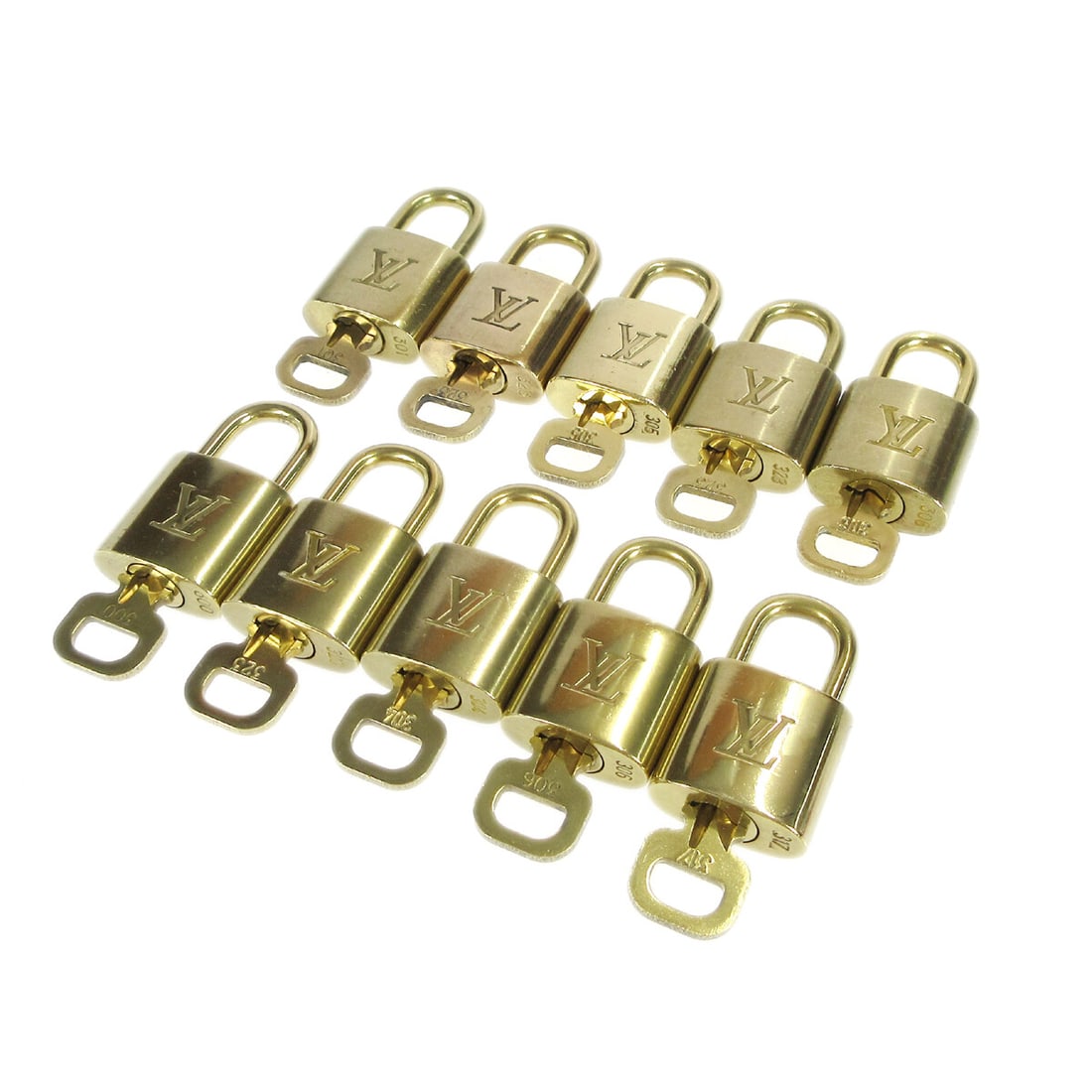 10 Piece Louis Vuitton Gold Tone Padlock and Key Charm Set: 10 Piece Louis Vuitton Gold Tone Padlock and Key Charm Set Louis Vuitton padlock and key bag accessory charm set in gold-tone finish. This 10-piece set is made in France and shows overall signs of use