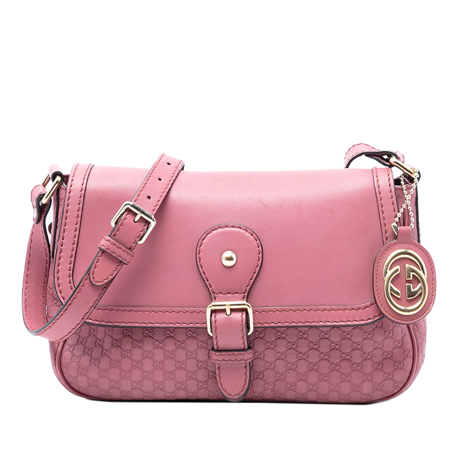 Pink Gucci Microguccissima Sukey Leather Crossbody Bag with Adjustable Strap: Pink Gucci Microguccissima Sukey Leather Crossbody Bag with Adjustable Strap The Gucci Microguccissima Sukey Crossbody is crafted from embossed leather in a pink hue and features an adjustable flat le