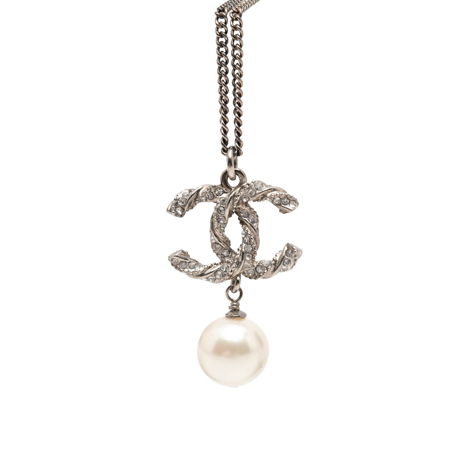 Chanel Twisted CC Pendant Necklace Silver Tone Faux Pearl Strass: Chanel Twisted CC Pendant Necklace Silver Tone Faux Pearl Strass Chanel twisted CC pendant necklace in silver-tone metal with faux pearl and rhinestone detailing. This costume jewelry piece features a