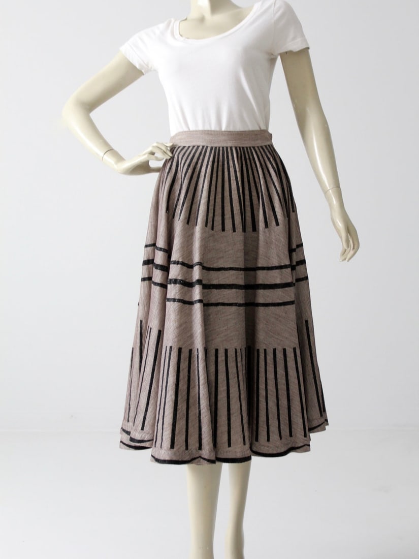 1950s Vintage Taupe Circle Skirt with Black Flocked Stripes: 1950s Vintage Taupe Circle Skirt with Black Flocked Stripes Step back in time with this stunning vintage 1950s circle skirt, a true piece from the era's New Look fashion. The taupe full skirt is
