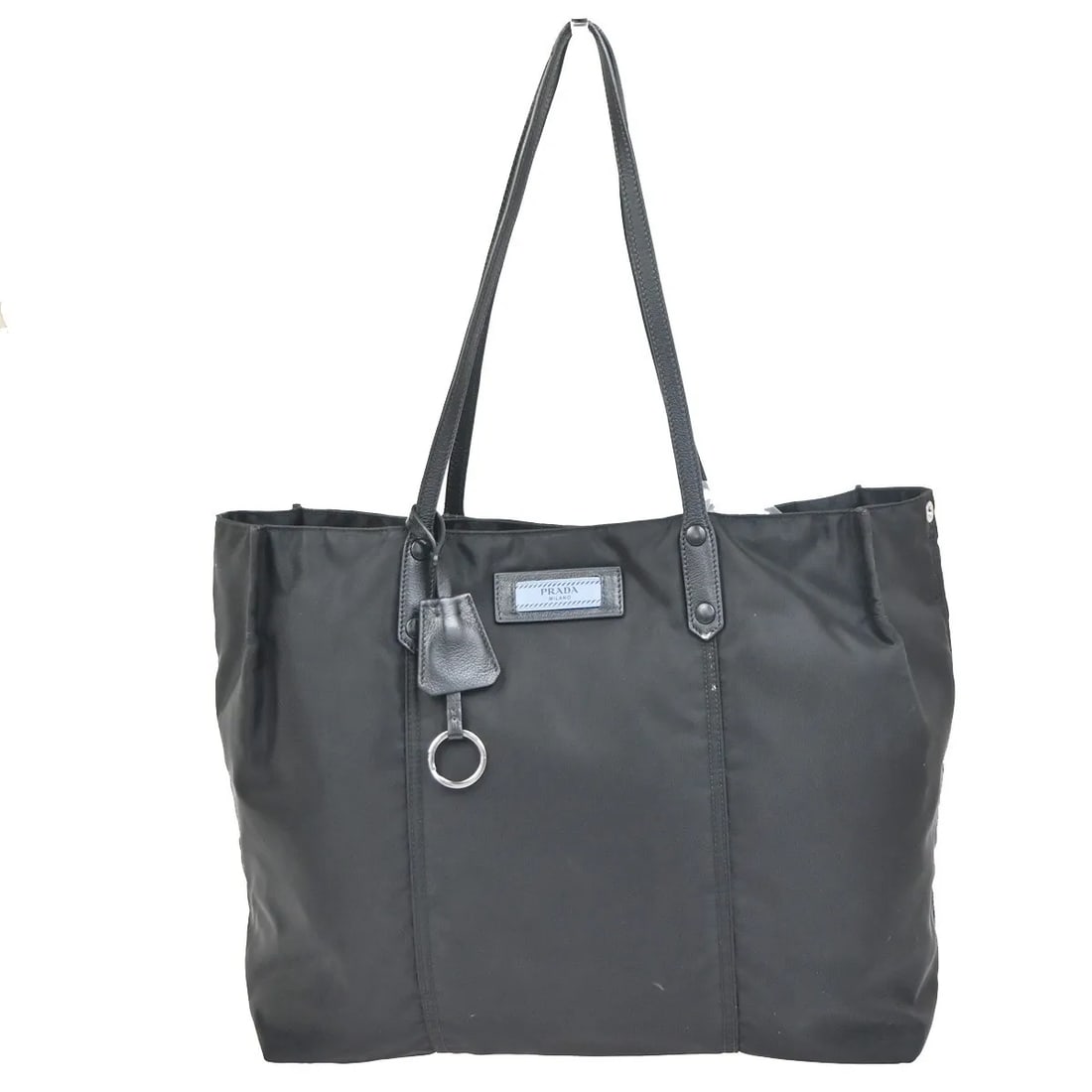 Black Nylon Prada Etiquette Tote Bag for Women: Black Nylon Prada Etiquette Tote Bag for Women The Prada Etiquette Tote is a stylish women's bag crafted from black nylon. Featuring a spacious interior and durable construction, this tote is designed