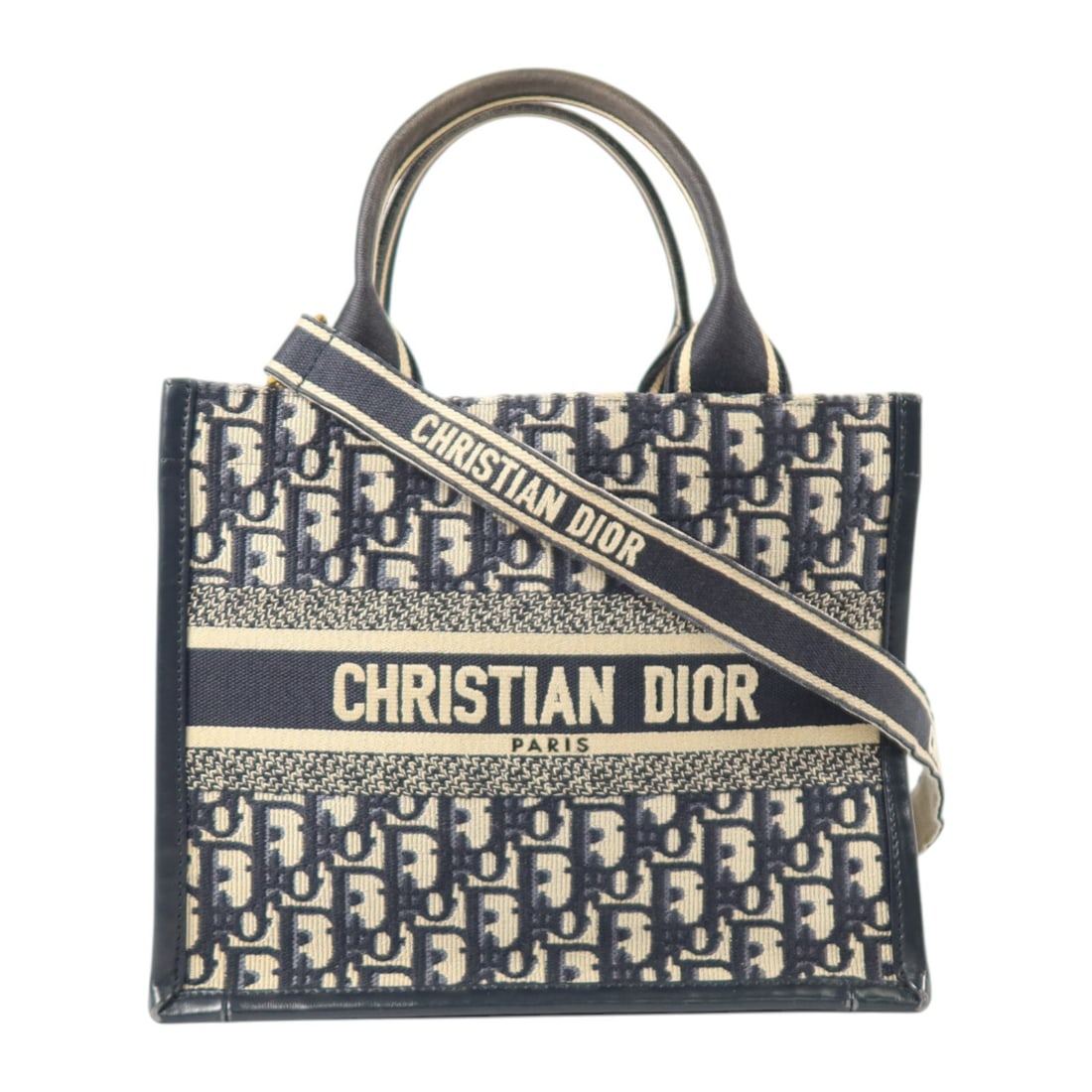 Dior Oblique Canvas Navy Book Tote 2way Shoulder Bag: Dior Oblique Canvas Navy Book Tote 2way Shoulder Bag This Christian Dior Book Tote is a versatile 2-way shoulder and hand bag crafted from navy Oblique canvas. Featuring a structured silhouette, it of