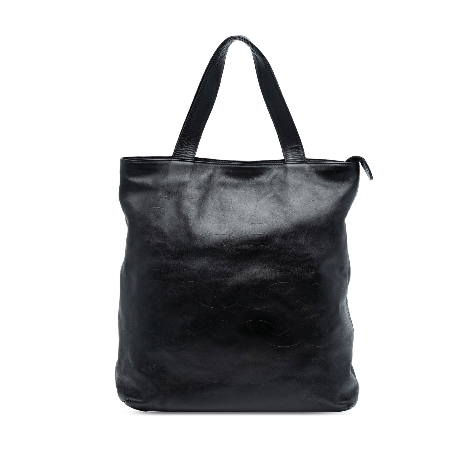 Chanel Black Leather Tote with CC Embossed Design: Chanel Black Leather Tote with CC Embossed Design This Chanel CC Embossed Leather Tote features a black leather body with embossed CC detailing, flat leather straps, a top zip closure, and interior zi
