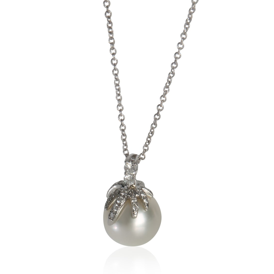 Fireworks Pendant in Platinum with Pearl and Diamonds by Tiffany & Co.: Fireworks Pendant in Platinum with Pearl and Diamonds by Tiffany & Co. This pre-owned Tiffany & Co. Fireworks pendant features a round brilliant-shaped pearl as its centerpiece, accented by 0.15 carat