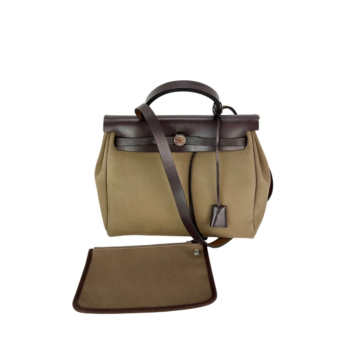 Hermes Herbag Toile Vache Hunter Zip 31 PM Shoulder Bag Brown: Hermes Herbag Toile Vache Hunter Zip 31 PM Shoulder Bag Brown This exquisite Hermes Toile Vache Hunter Herbag zip 31 PM shoulder bag features a stylish trapezoid shape with an elegant brown exterior. 